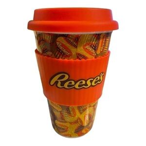 REESE’S 16 oz ceramic travel cup with silicone lip and insulator grip.